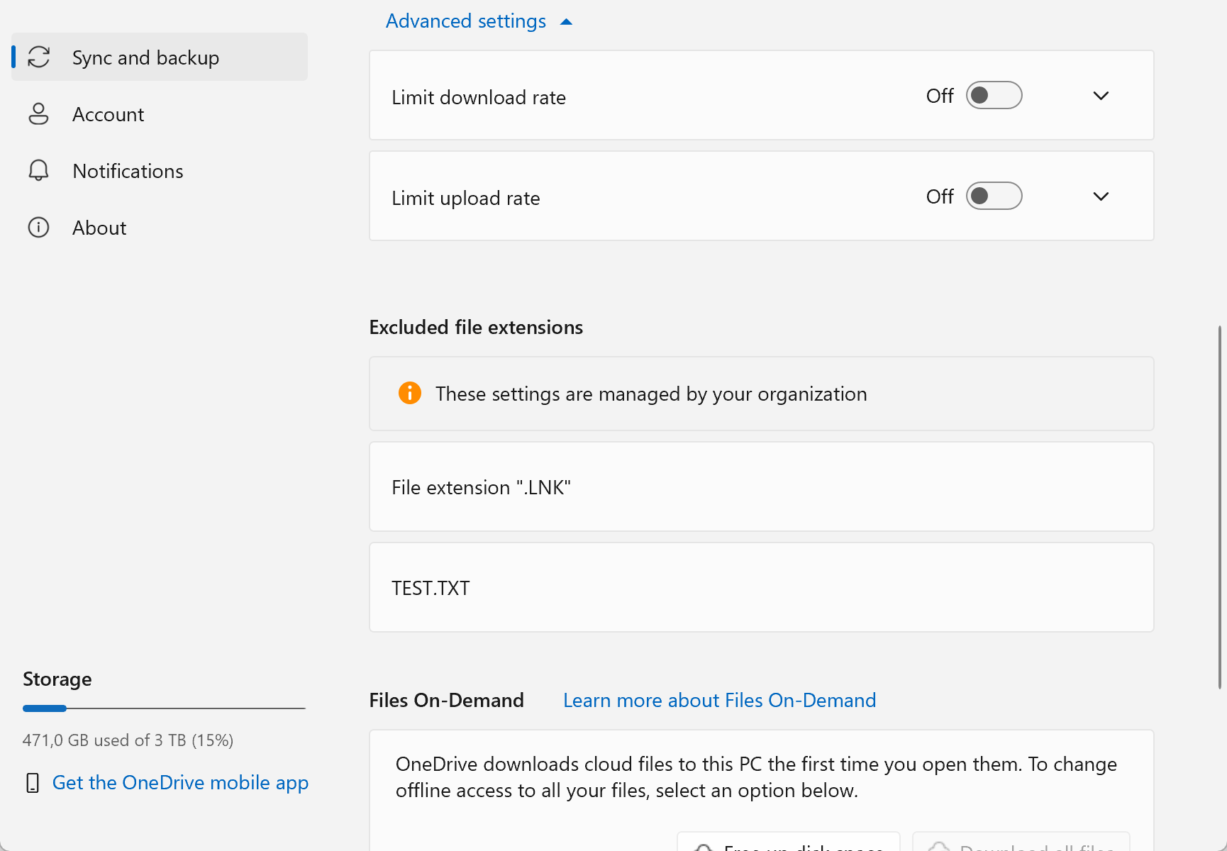 Screenshot showing the settings of a OneDrive for Business account, which now shows a section named Excluded file extensions and a note that the settings are managed by the organization. The screenshot shows that file extensions that end with .LNK plus files named TEST.TXT will be excluded from sync.