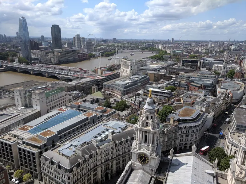 Panoramic view over central London rooftops and the River Thames from high on St Paul's Cathedral